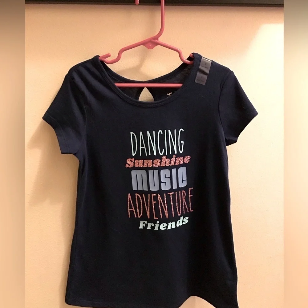 Justice girl’s dark blue size 7 t-shirt. New with size tag on shoulder